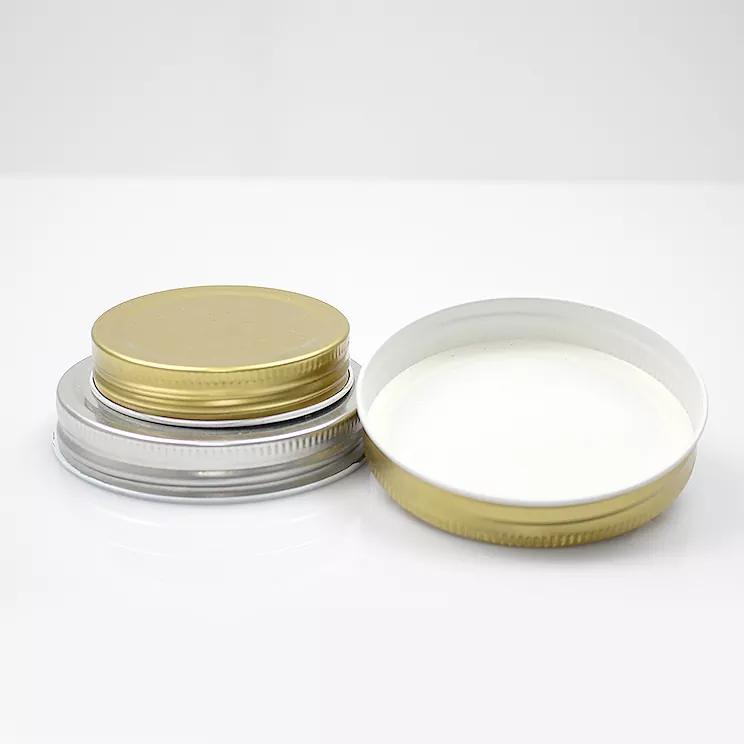 Bouchon à vis multicolore pour bouteille cosmétique